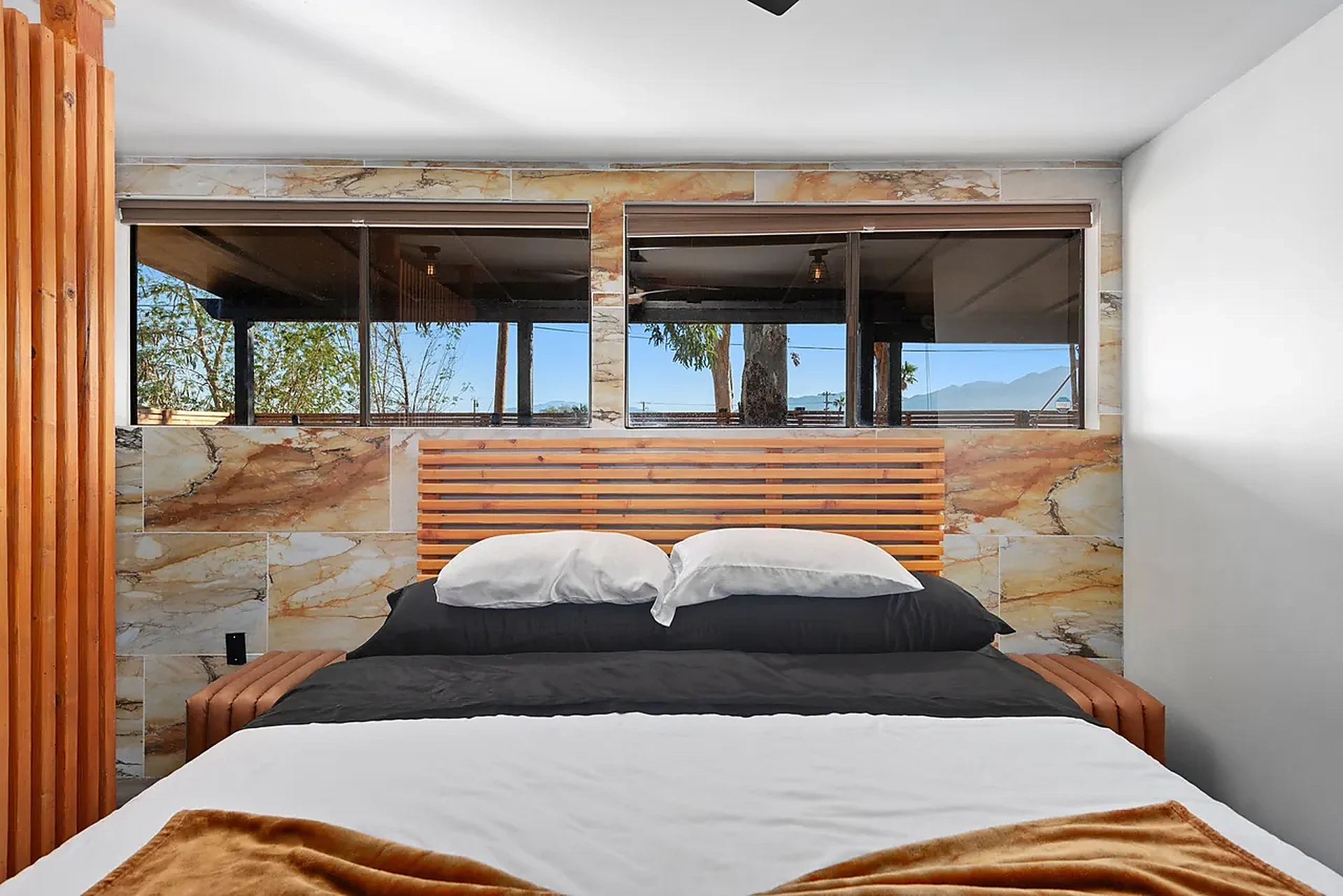 Master bedroom with marble headboard wall