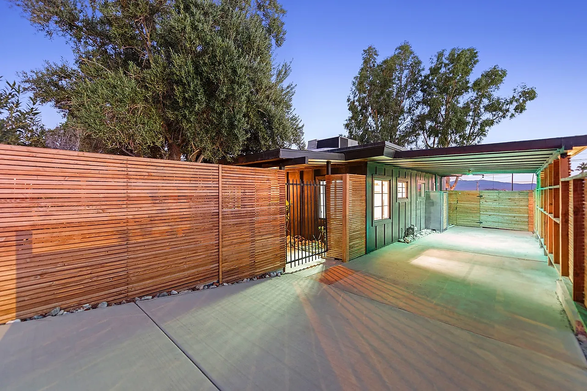 Exterior entrance with wood fencing